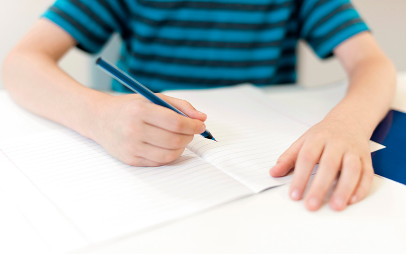 Primary student practicing writing skills.