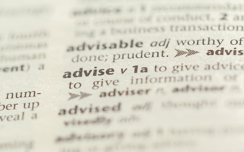 A close-up of a dictionary entry for the word "advise,"