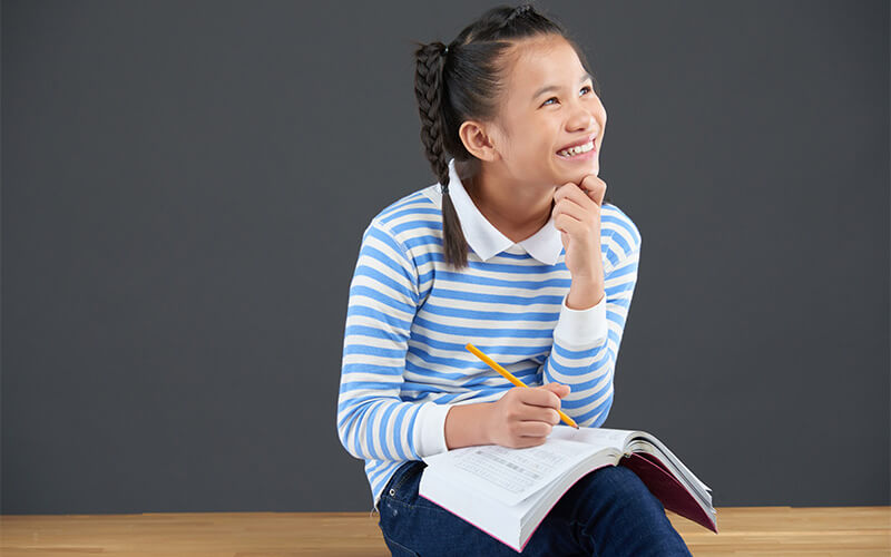 smiling-student-girl-thinking-with-notebook